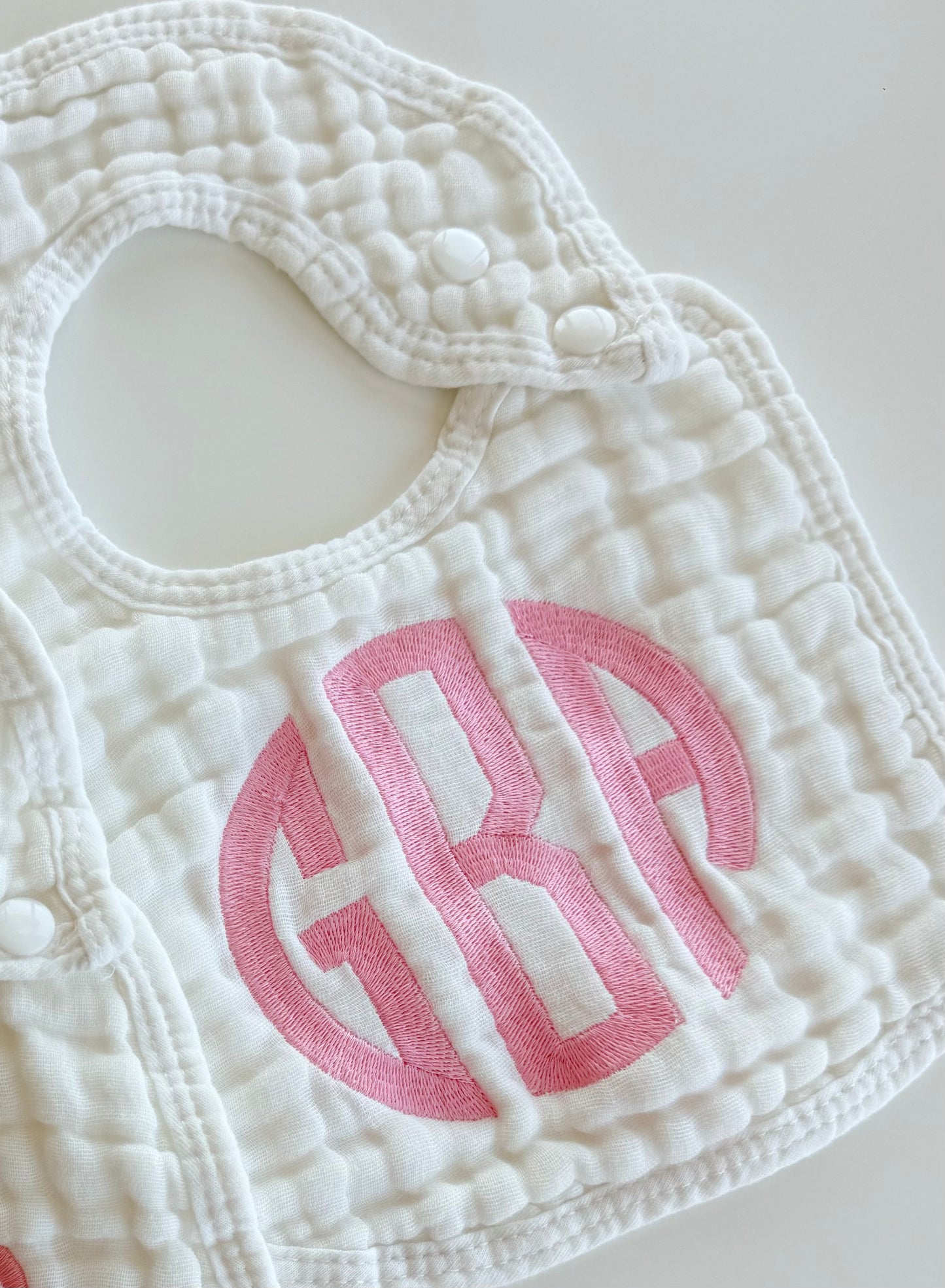 Monogram Muslin Baby Bib