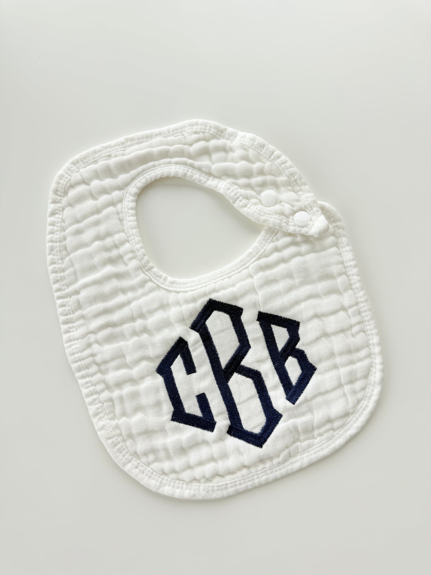 Monogram Muslin Baby Bib