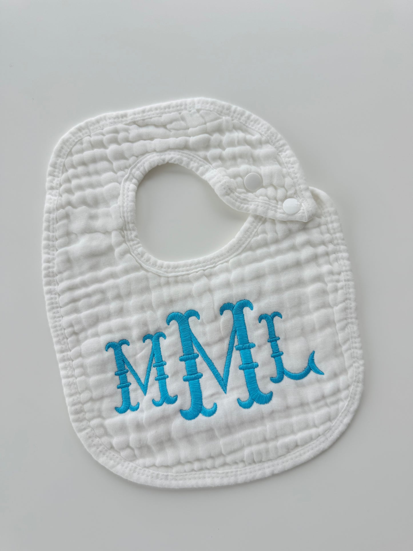 Monogram Muslin Baby Bib