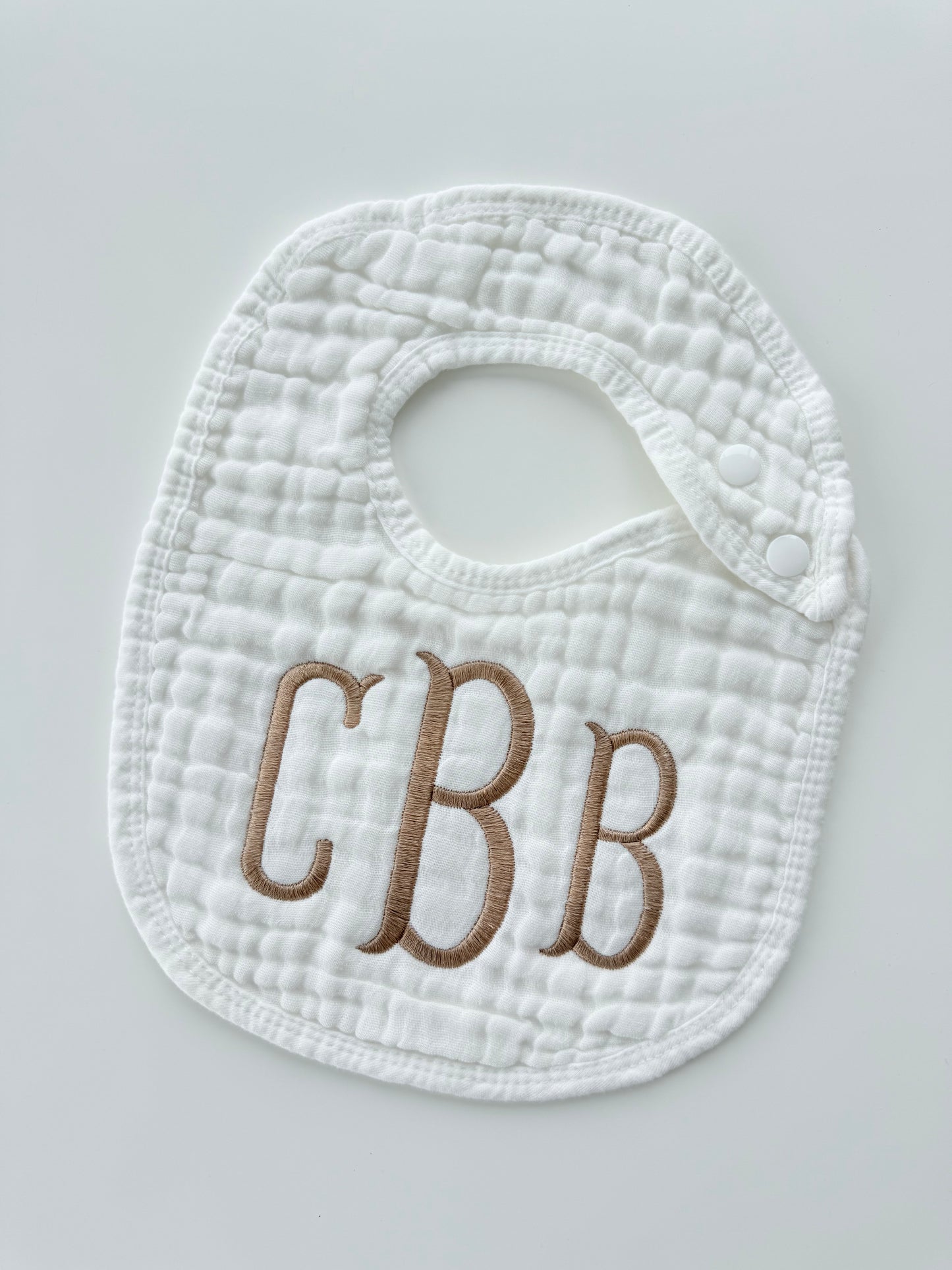 Monogram Muslin Baby Bib