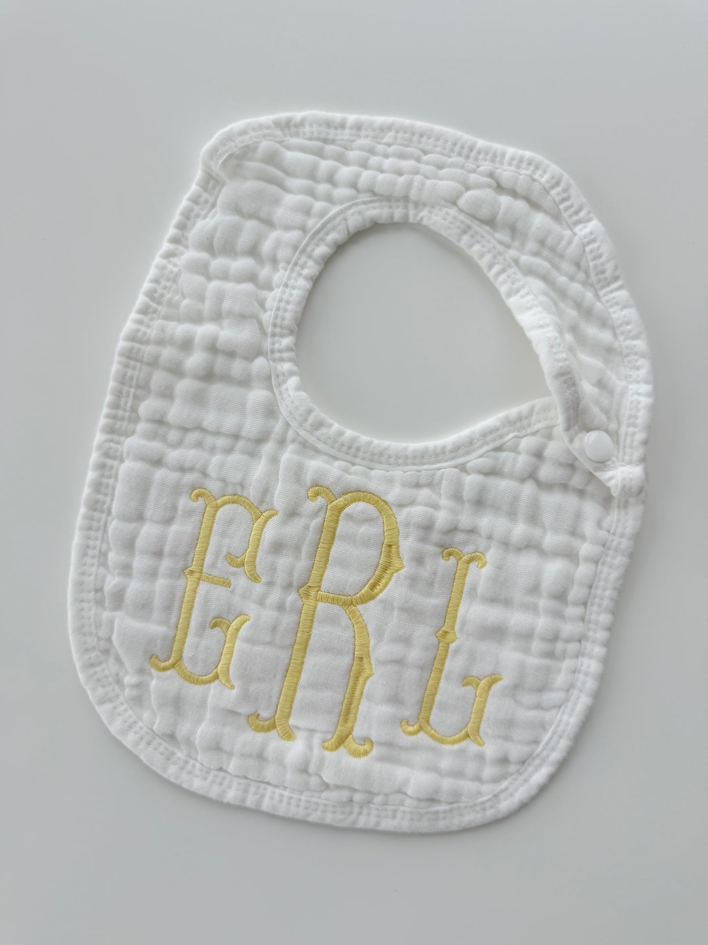 Monogram Muslin Baby Bib